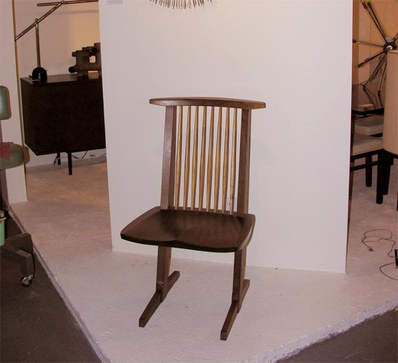 Conoid chair designed by George Nakashima. Chair is dining or conversation height. Perfect for use with a desk. Assembled in Japan with materials imported from Nakashima New Hope, PA studio.  Signed under seat.