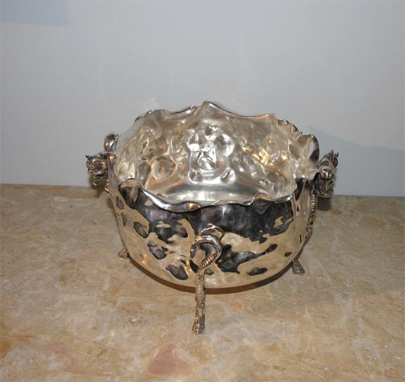 A Victorian silver-plated serving bowl made by the Pairpoint Manufacuring C. in New Bedford, Massachusetts. C. 1875, in a rustic style with squirrel handles raised on 4 