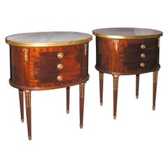 A Pair of Louis XVI style Mahogany and Walnut small side tables.