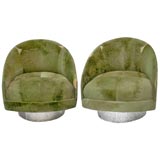 pair of shearling swivel chairs