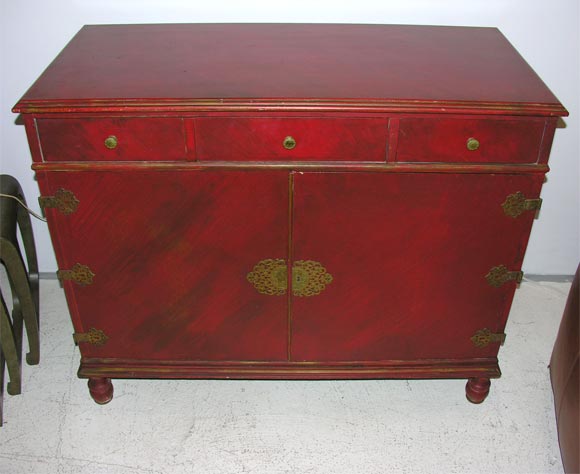 Interesting red lacquer dresser in Oriental style
