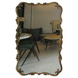 Baroque style gilded metal mirror frame.