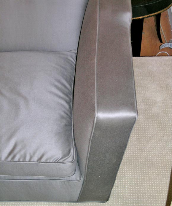An elegant designed sofa reupholstered in smoke grey J.Robert Scott sateen wool fabric.