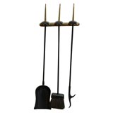 wall mounting fire tool set by Donald Deskey.