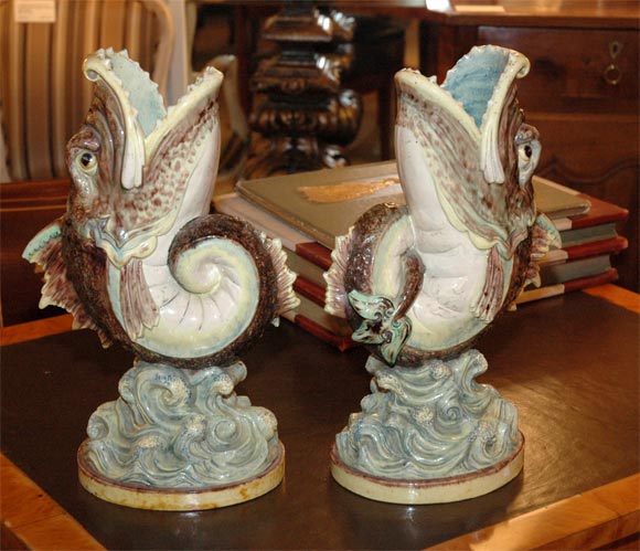 Rare large pair of Majolica Palissy Vases made in France circa 1880.  Beautifully executed carp dancing above waves. This design was inspired by export vases that originated in Japan during the 17th century.