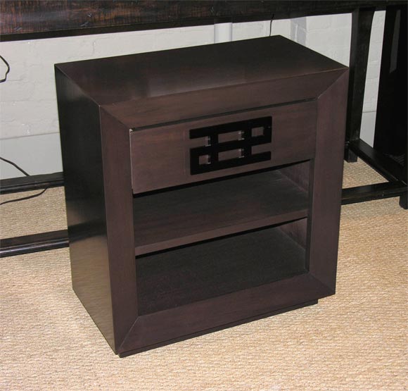 Pair of mahogany nightstands with black plastic pulls
