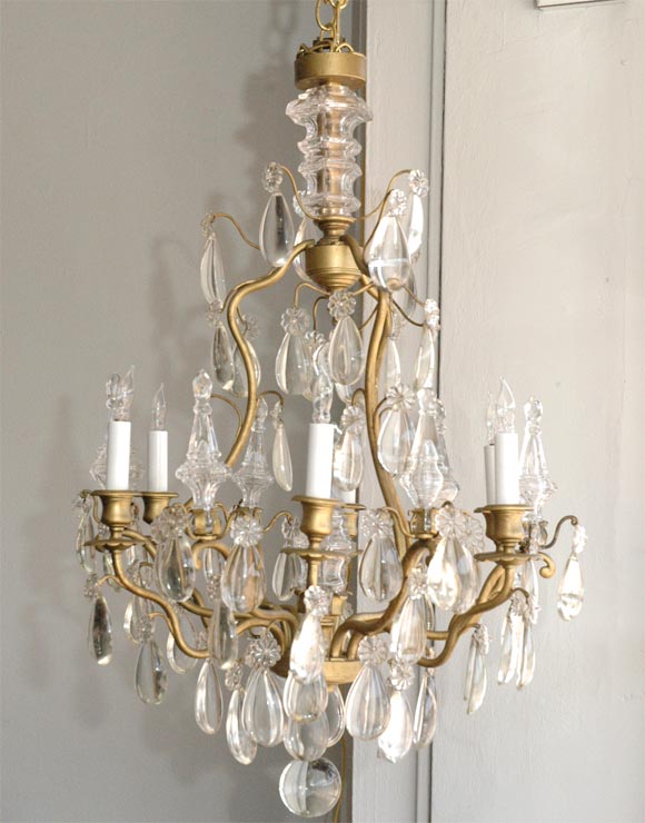 Elegant chandelier by Maison Baguès. Six lights with clear crystal tear drops, daggers and rosettes.