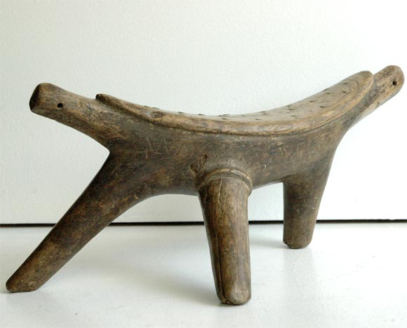 Objects like these were used by African men of various tribes to protect their elaborate hairstyles. Willis described the practice of covering hair with a paste made of clay mixed with other organic materials, and then shaping it into the desired