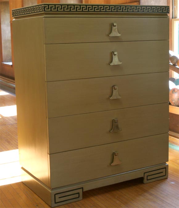 Five drawer solid wood chest with carved wood Greek key design and bell shaped bronze pulls.