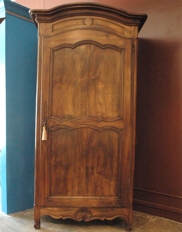 Walnut Armoire with three shelves.  restored.