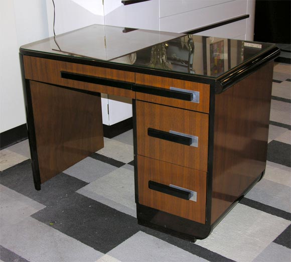 Beautiful Bookmatched Walnut with black lacquer and Brushed Aluminum Pulls. Great streamilne design and finished all around so it can be floating in a room.