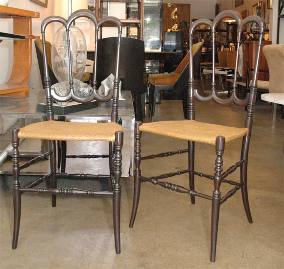 Nice pair of chiavari chairs in dark walnut finish and cane.