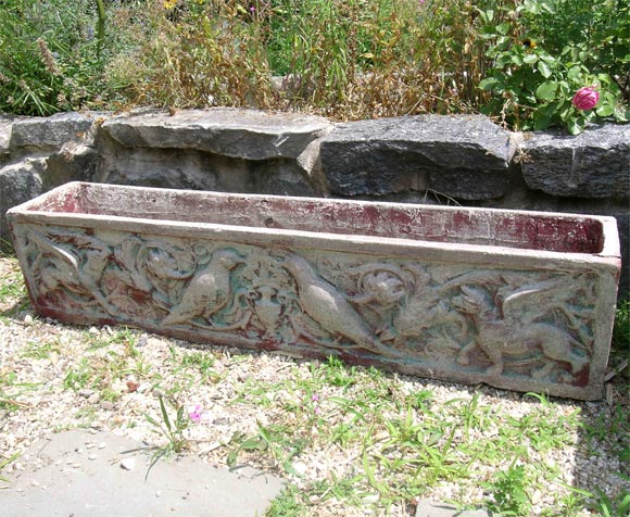 Planters with bas relief of birds griffon and urn