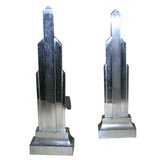 Pair of Silvered Bronze Skyscraper Form Andirons