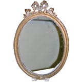 A Rococo style oval mirror