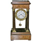 A Louis Phillipe mahogany ormolu-mounted mantel clock