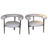 Pair of round white leather  armchairs