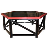 Six sided black and red cocktail table with brass inlay