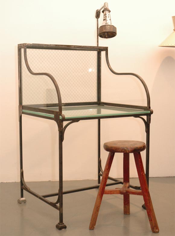Stripped Steel and safety glass florist desk with attached industrial light.  Great for a hostess stand in restaurant or telephone desk in a residence!  Beautiful curves and industrial details.