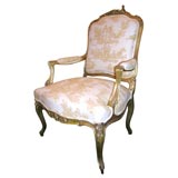 A gilt and carved wood Louis 15th Style Arm Chair