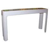 White lucite glass top console table.