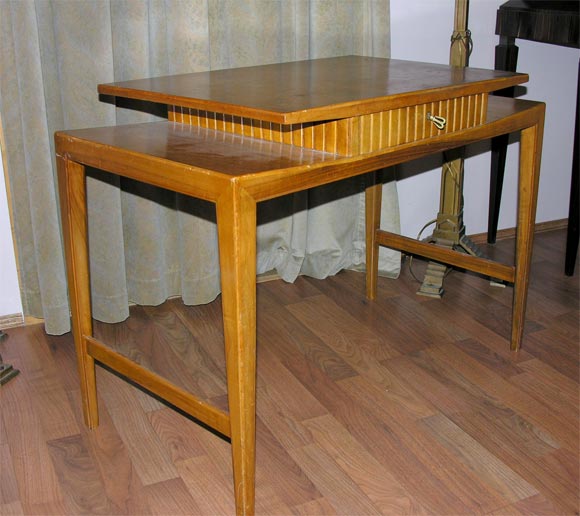 A Gio Ponti fruitwood desk.