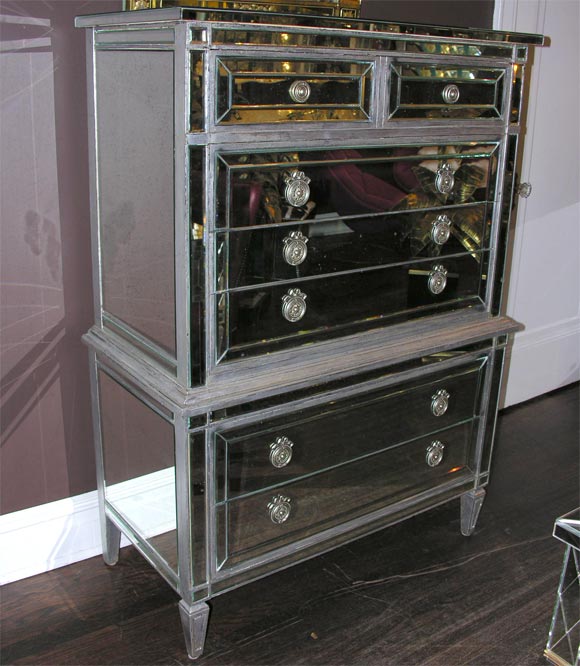 Custom silver trim mirrored highboy with 7 drawers. Customization is available in different sizes and finishes.