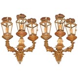 A pair of gilt tole sconces