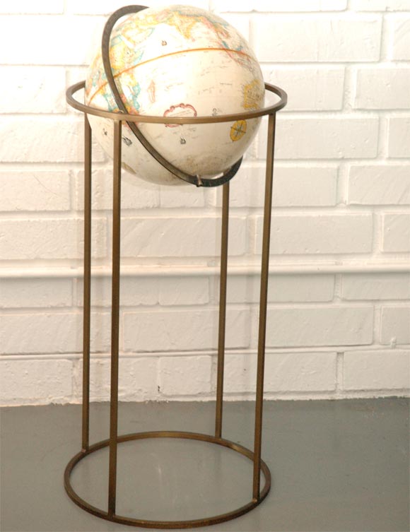 Paul Mccobb globe on antique brass stand.  Great patina and orignal condition.