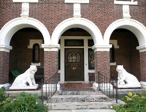 Pair of very large marble tigers, in white marble with a gray grain.  Handsomely wrought, presently gracing one of Hudson's historic mansions.