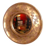 round gold leafed mirror