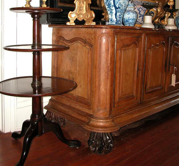 English George III Mahogany dumbwaiter 3 tiered with movable tiers on a trifed base with pad feet and original rollers.