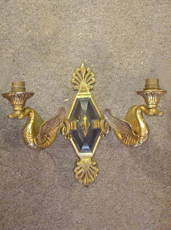 Double arm French Empire style Bronze sconce with a swan and anthemion motif. 10 3/4