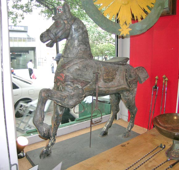 A fine and rare painted and carved carousel horse, attributed to C.W. Dare and Co., New York (see footnote below), third quarter 19th C, having what appears to be the original paint, which has darkened over the years, and the original wrought iron