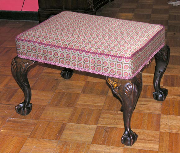 Georgian mahogany stool on cabriole legs with carved shell on knees ending in ball and claw feet.