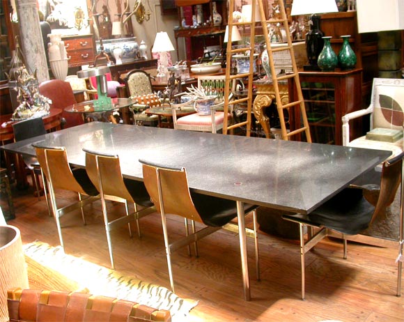 Craig Ellwood Dining table with a set of 8 black leather chairs