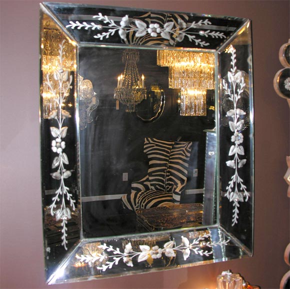 Small Venetian mirror with etched flowers.