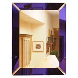 Mirror with Purple Glass Surround.