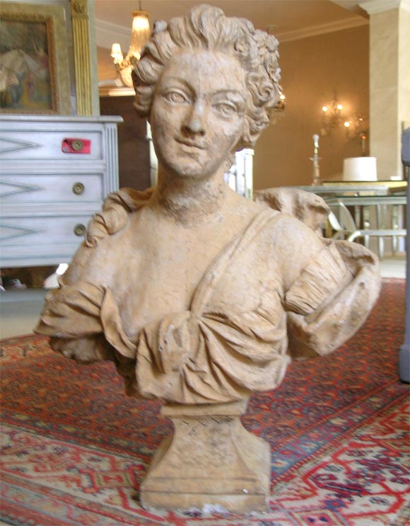 Beautifully executed 19th century Swedish bust of an aristocratic woman. The bust is cement and terracotta.