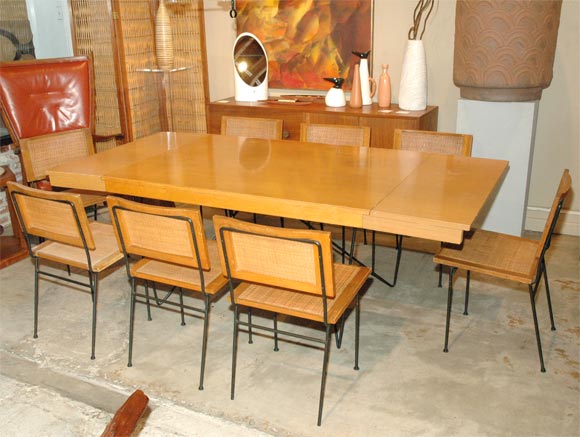 Classic California modern elements: Mahogany as well as cane & iron, are utilized in this set by Sausalito’s Luther Conover.  The table features two slide out ends to accommodate two 15