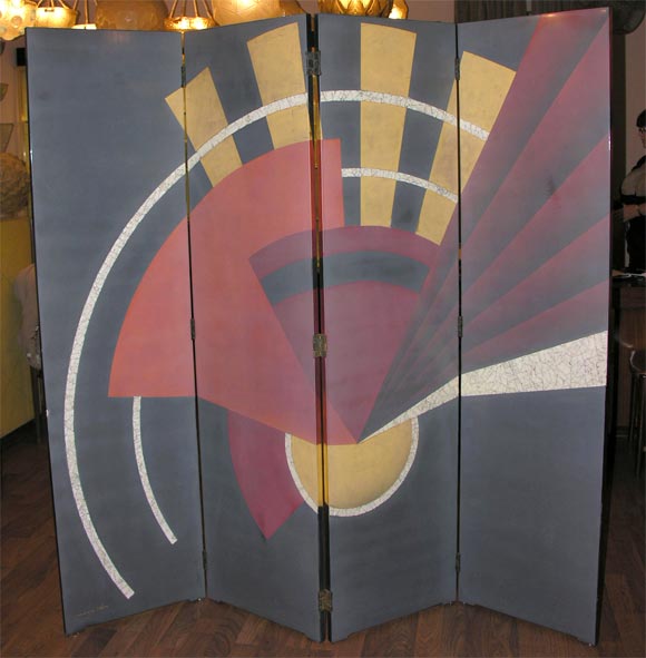 An Art Deco screen by Paul Sain (1904-1995), from circa 1938, comprised of four hinged lacquered wood panels painted with geometric motifs.
