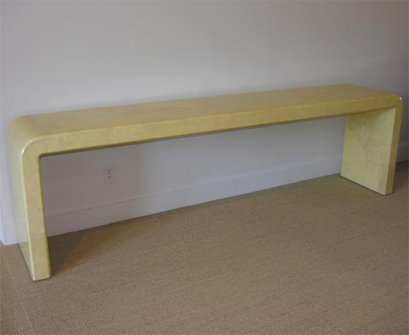 A Karl Springer Lacquered Parchment Waterfall Table.