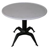 An Art Deco Iron and Marble Table.