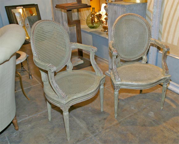 Pair of Caned Arm Chairs