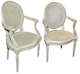 Pair of Caned Arm Chairs
