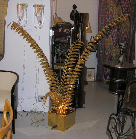 one of a kind decorative potted palm tree floor lamp with gilded leaves and glass pearls, c. 1970.<br />
the light fixture came from the residence of the actrice deborah kerr in klosters, switzerland.