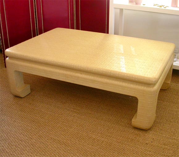 Dark Cream textured linen wrapped table.  Asian inspired legs.