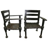 A Pair of West African Ironwood and Leather Chairs