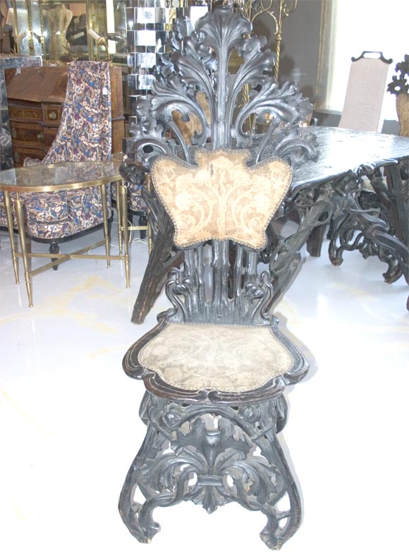 Absolutely museum quality. Intricately carved with original velvet upholstery. A graceful design, rarely seen with such abundance of detail. Design possibly as specified by Antonio Gaudi for an apartment building of his design in Barcelona.