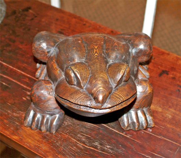 carved wooden frog